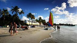 ST JOHN'S, ANTIGUA AND BARBUDA - MARCH 10: A catamaran with a colourful sail sits on the beach just outside St John's on March 10, 2008 in Dickenson Bay, Antigua. (Photo by Chris Jackson/Getty Images)