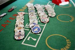 MACAU, CHINA: Chips for gambling displayed at the 4th International Gaming and Entertainment Expo in Macau, 28 April 2005. Macau has recently seen a huge influx of casinos that have awakened with a jolt the once ailing economy.