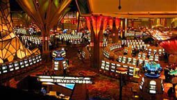 UNCASVILLE, CT - NOVEMBER 20: Gamblers play on some of the more than 6,000 slot machines at Mohegan Sun casino November 20, 2002 in Uncasville, Connecticut. The casino is owned and operated by the Mohegan Tribe which is a sovereign federally recognized Indian Nation. The casino achieved net revenues of $786.8 million in the fiscal year 2001.