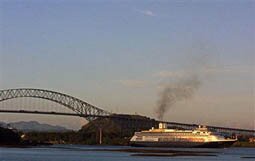 CANAL DE PANAMA, PANAMA: The cruise ship 'Amsterdam' passes under the Bridge of the Americas on the Panama Canal 10 January 2002. AFP PHOTO/Guido BLANDON